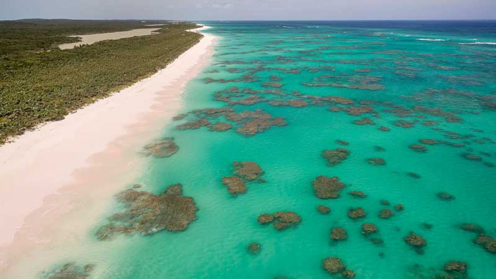 Aerial view of the dotted coral formations along the Atlantic Ocean side of Cat Island, Bahamas (Copyright (c) 2021 pics721/Shutterstock.  No use without permission.)